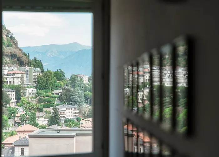 Apartment I D'a Charming Penthouse - View- Como- House-130 Mt-2 Double Bedrooms And 2 Double Bathrooms A Spacious Living Room-full Equipped Kitchen-private Garden And Terrace-private Covered Parking